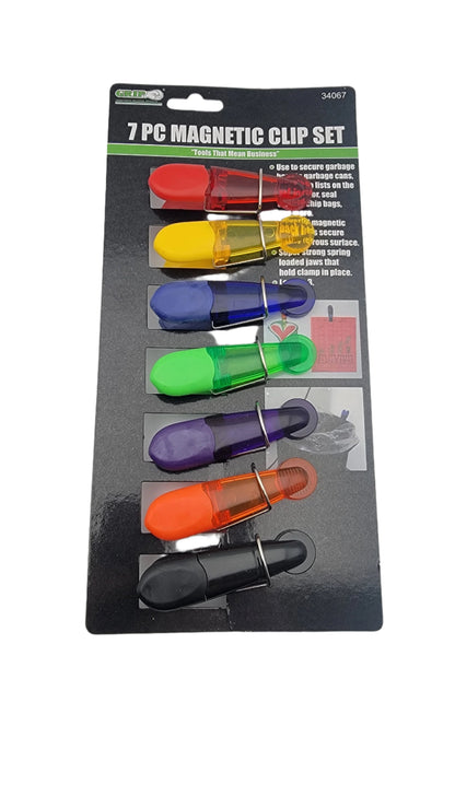 The 7-piece magnetic clip set features clips in black, red, yellow, green, blue, purple, and orange colors presented on a black card.