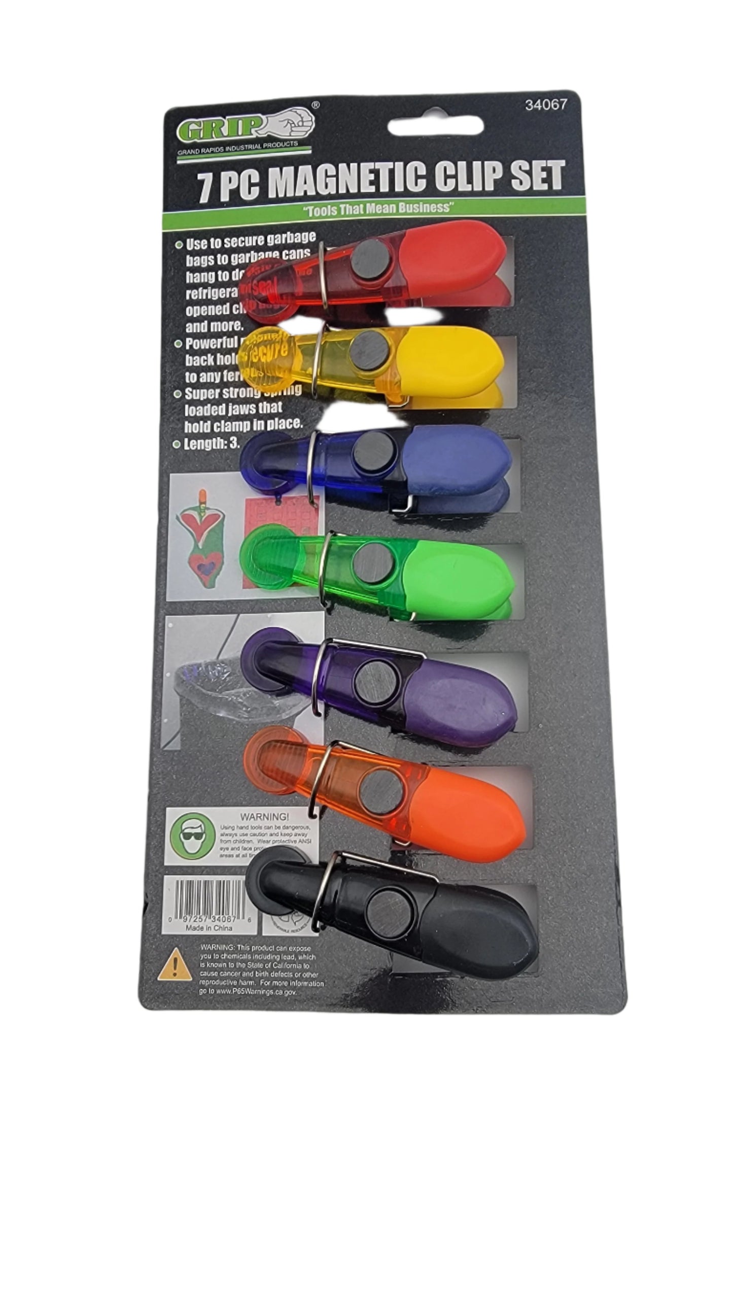 The 7pc magnetic clip set features seven vibrant magnetic clips, each in a unique color, neatly displayed on a sturdy cardboard backing. The packaging provides instructions and includes a safety warning.