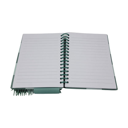 The Ho ho ho notebook features lined pages in an open spiral-bound format with a green cover.