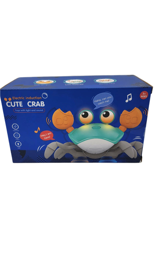 Box of the Cute Crab electric induction toy with lights and sounds, featuring a colorful crab image and playful text.