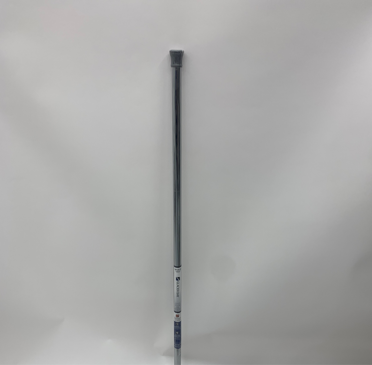 The Glacier Bay 86" Carbon Steel Shower Rod Chrome is positioned vertically against a plain white background, featuring a grip end and label.