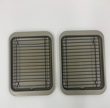 Two Set of 2 Roast & Broiler Pans with black cooling racks, set on a white background.