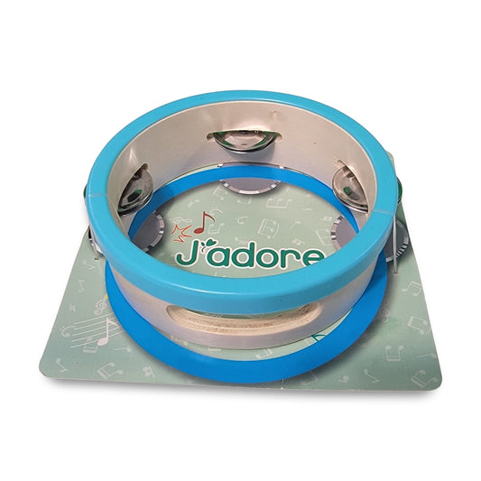 The J'adore wooden Tambourine is shown resting on a green surface with musical notes and the word "J'adore.