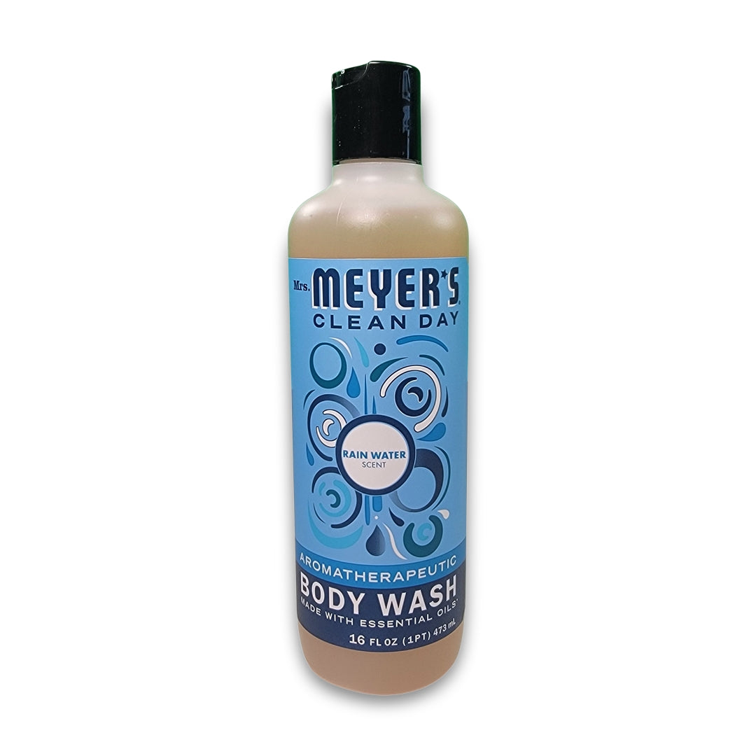 A 16 fl oz (473 ml) bottle of Mrs. Meyer's Clean Day Body Wash in Rain Water scent with a blue label featuring circular designs.