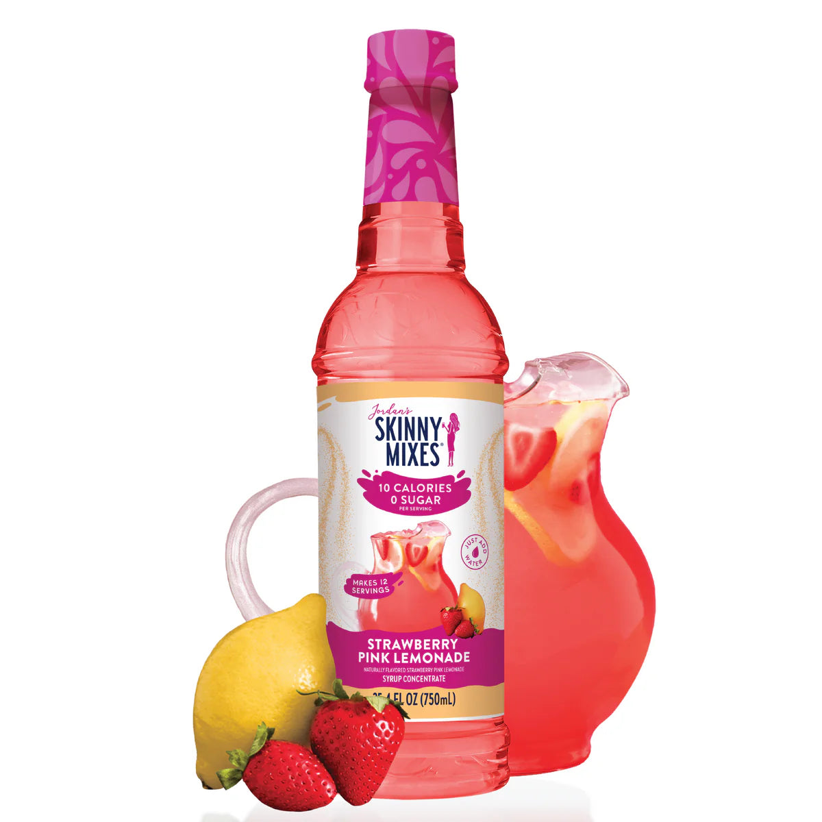 A bottle of Jordan's Skinny Syrup Strawberry Lemonade, Sugar Free.25.4oz stands beside a glass pitcher filled with the beverage. A lemon and strawberries are placed in front.