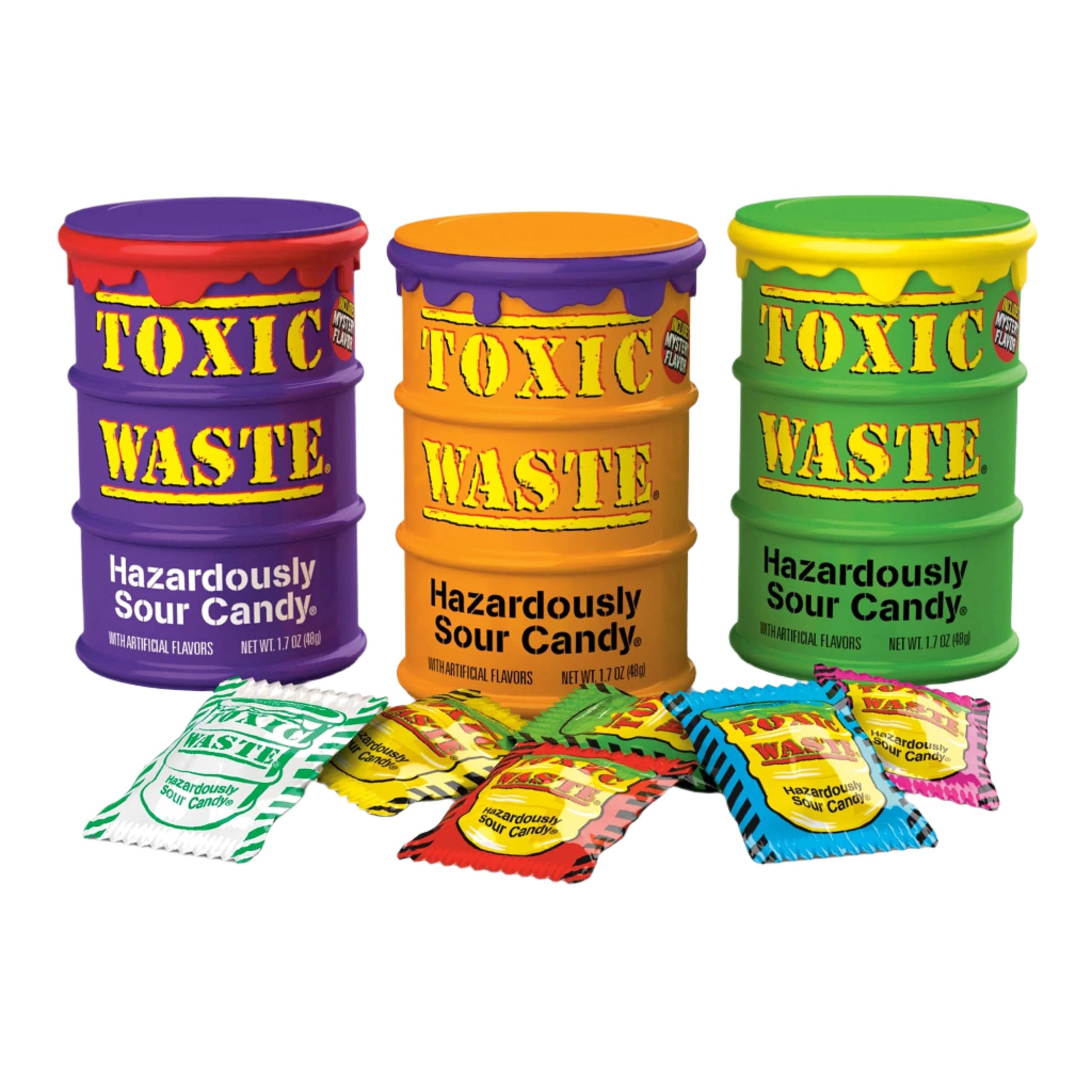 Three vibrant barrels of Toxic Waste Limited Edition Candy labeled "Hazardously Sour Candy" with assorted candy packets displayed in front.